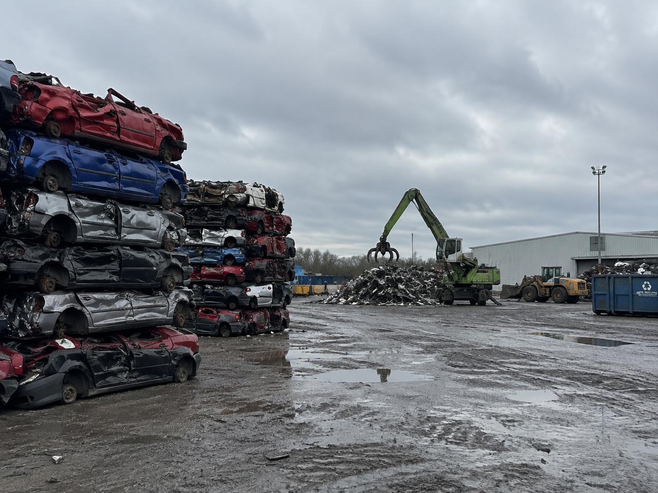 Stacked scrap vehicles at a car recycling yard serving Grundy and Will County