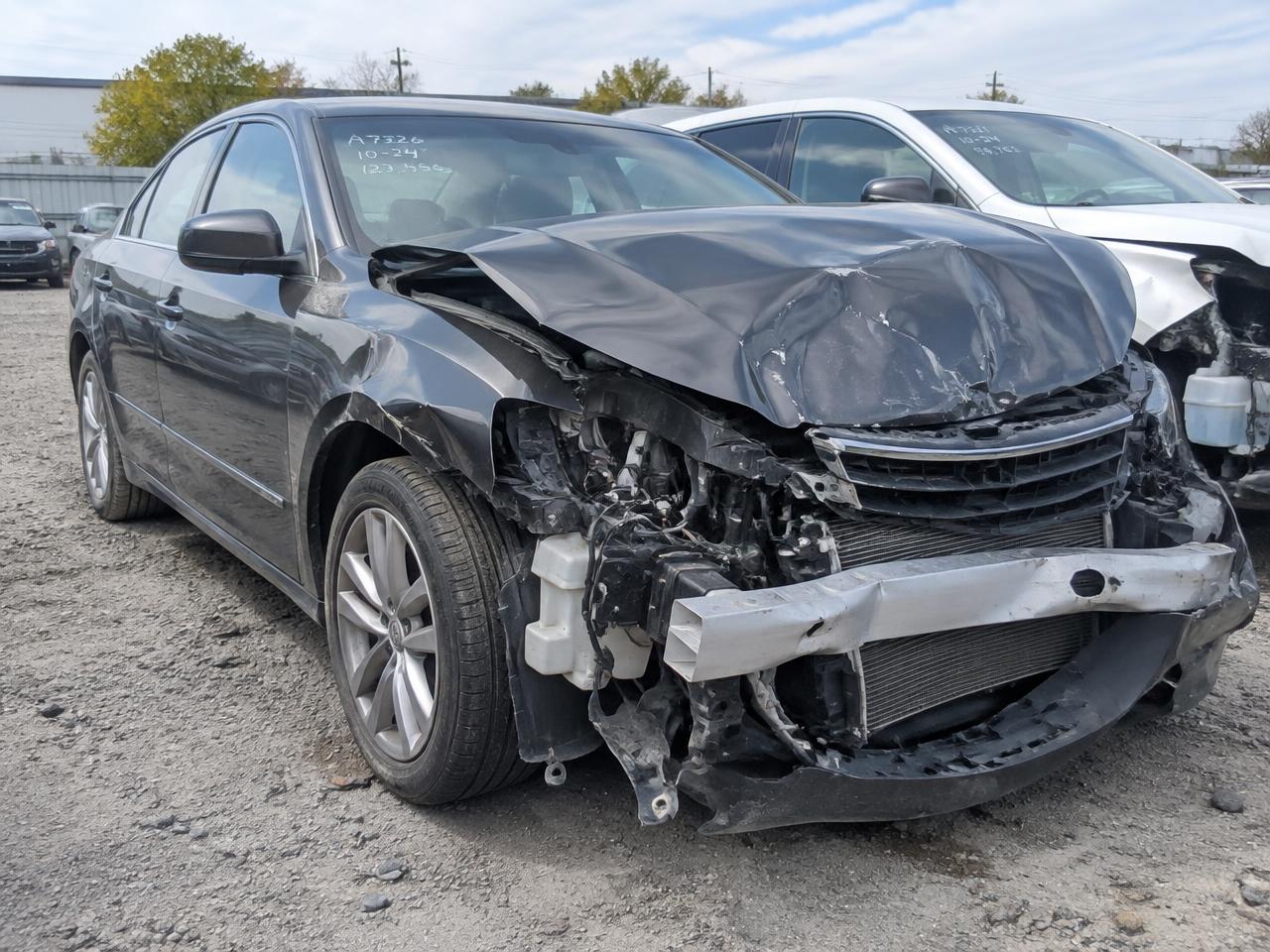 Wrecked sedan with front-end collision damage bought for cash in Minooka IL